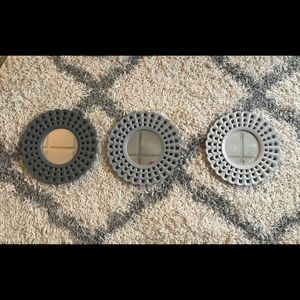 Three small round mirrors